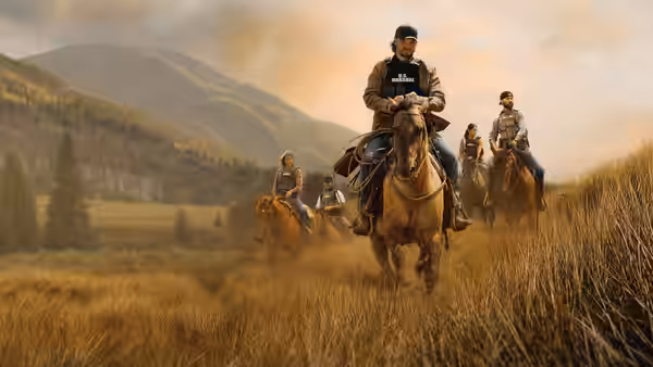 Four marshals ride horseback through a golden field beneath the mountains