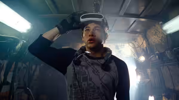 Wade (Tye Sheridan) lifts his visor inside a cramped vehicle