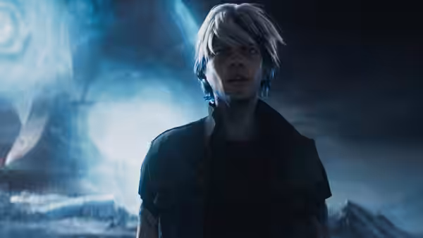 A white-haired young man stands against a blue-lit futuristic backdrop