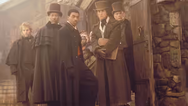 Theodore Joadson (Morgan Freeman) and other men gather outside a stone courthouse