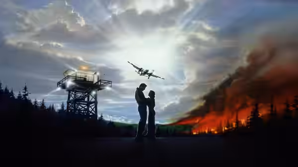 A silhouetted man watches a firefighting aircraft pass as flames consume the hillside