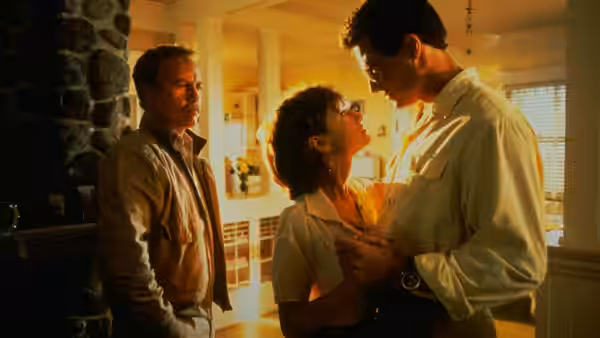 Dorinda Durston (Holly Hunter) looks up at Ted Baker (Brad Johnson) as Pete Sandich watches