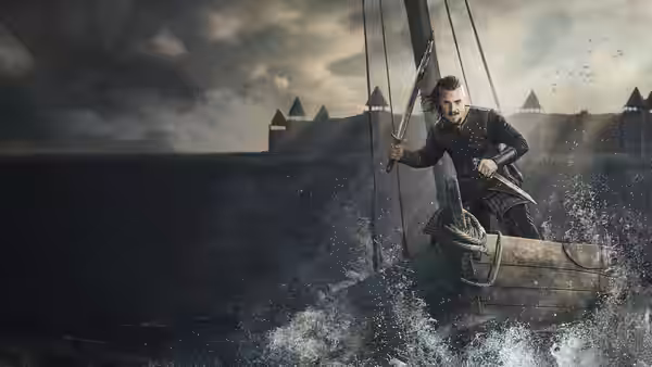 Uhtred of Bebbanburg (Alexander Dreymon) steers a small boat toward a fortified shoreline