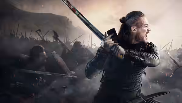 Uhtred of Bebbanburg (Alexander Dreymon) raises his sword amid a battlefield