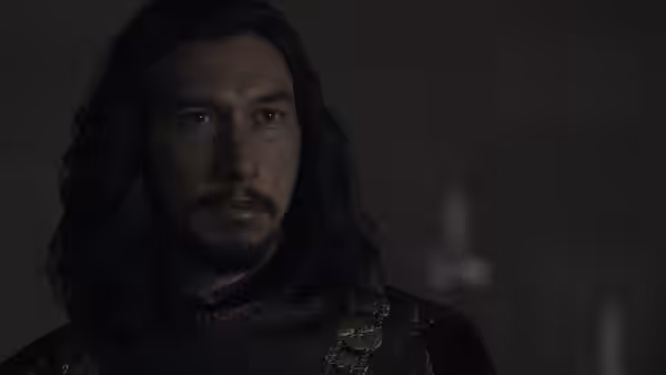 Jacques Le Gris (Adam Driver) looks ahead in dark medieval clothing