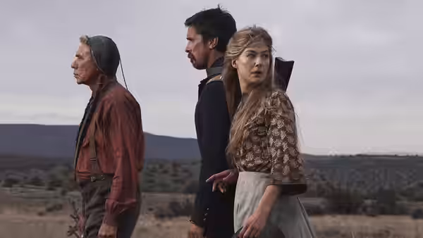 Chief Yellow Hawk, Captain Blocker and Rosalee Quaid stand together on an open plain