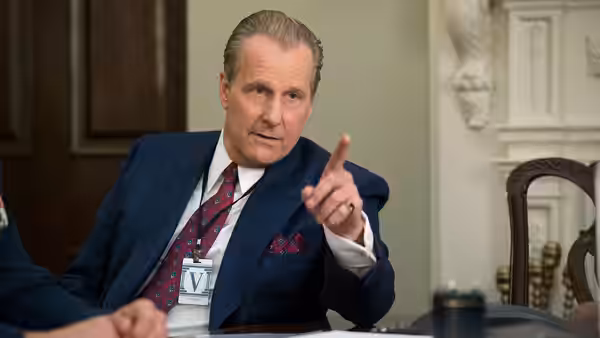 John O'Neill (Jeff Daniels) gestures across a conference table