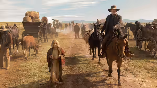 Johanna stands among covered wagons as Captain Jefferson Kyle Kidd rides past on horseback