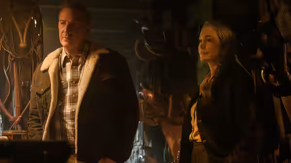 George Blackledge (Kevin Costner) and Margaret (Diane Lane) stand inside a dimly lit room