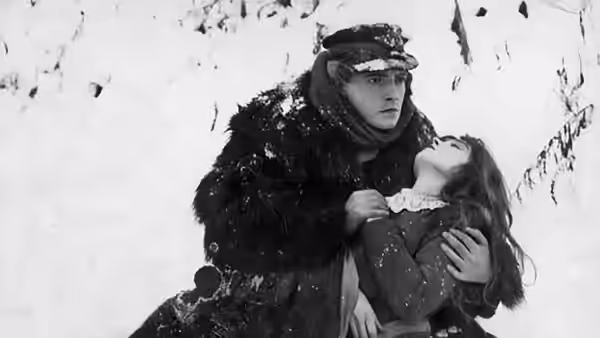 David Bartlett (Richard Barthelmess) carries Anna Moore (Lillian Gish) across the ice