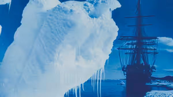 A sailing ship passes beside a towering iceberg fringed with icicles