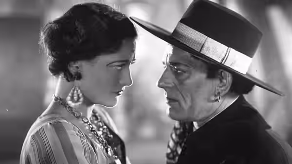 Alonzo (Lon Chaney) and Nanon Zanzi (Joan Crawford) face each other closely