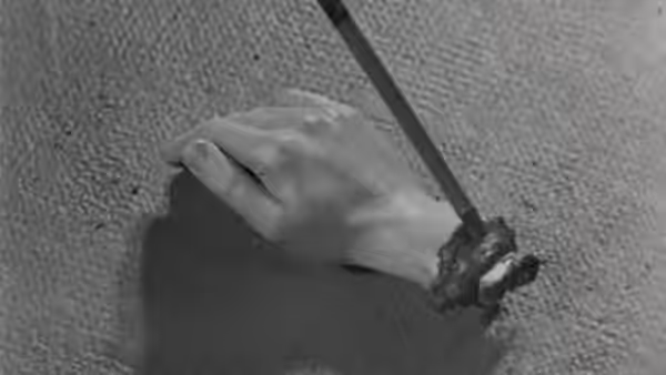Ants crawl from a hole in a hand