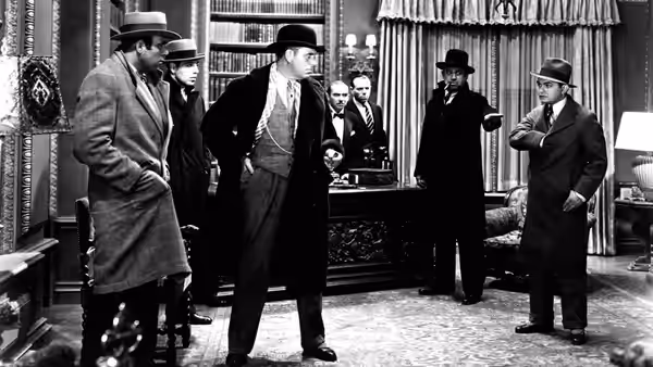 Gangsters in hats and overcoats gather in a furnished office