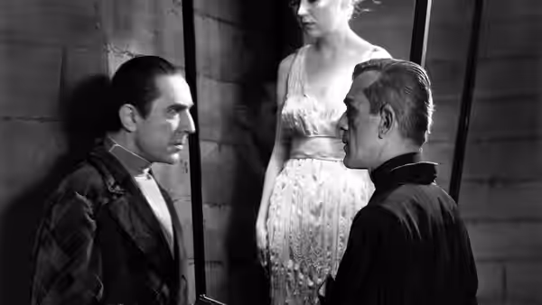 Dr. Vitus Werdegast (Bela Lugosi) faces Hjalmar Poelzig (Boris Karloff) beside a woman in white