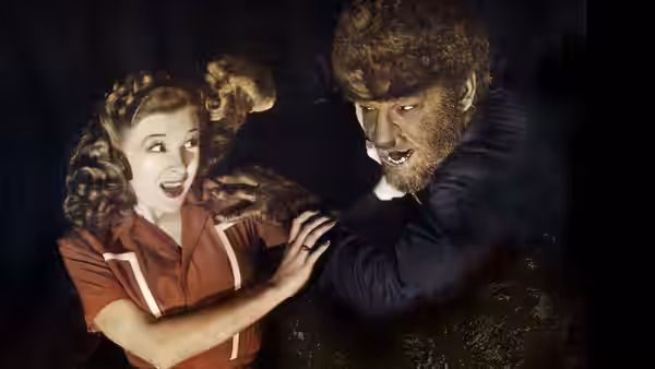 Gwen Conliffe (Evelyn Ankers) recoils as the Wolf Man reaches toward her