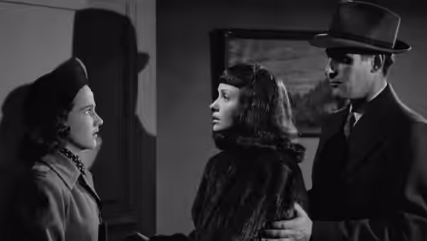 Jacqueline Gibson faces Mary Gibson as Gregory Ward stands beside Mary