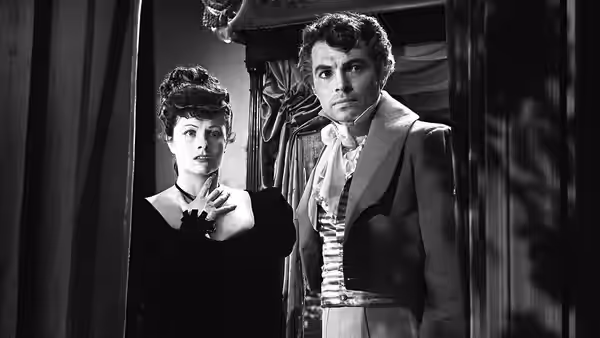 Lord Rohan (James Mason) and Hesther Shaw Barbary (Margaret Lockwood) stand together in a doorway