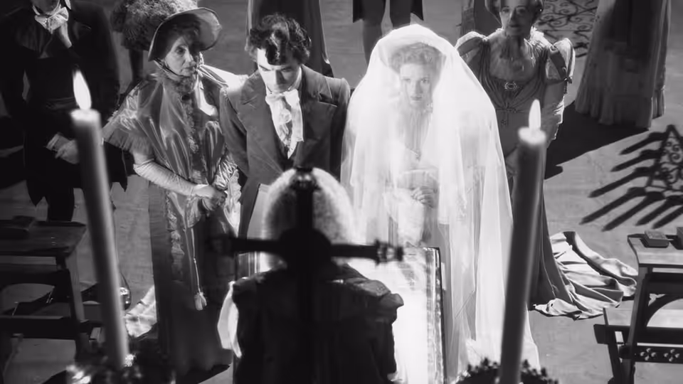 A bride and groom stand before a priest as mourners gather for their wedding ceremony