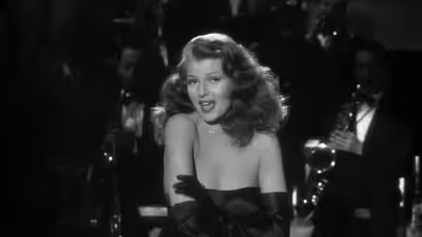 Gilda (Rita Hayworth) sings onstage before men in a nightclub