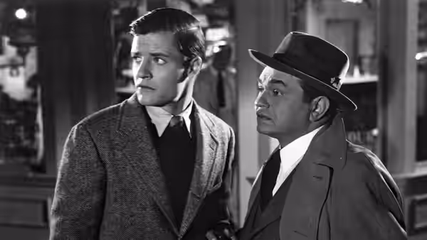 Noah Longstreet (Richard Long) and Federal Agent Wilson (Edward G. Robinson) look off to the side