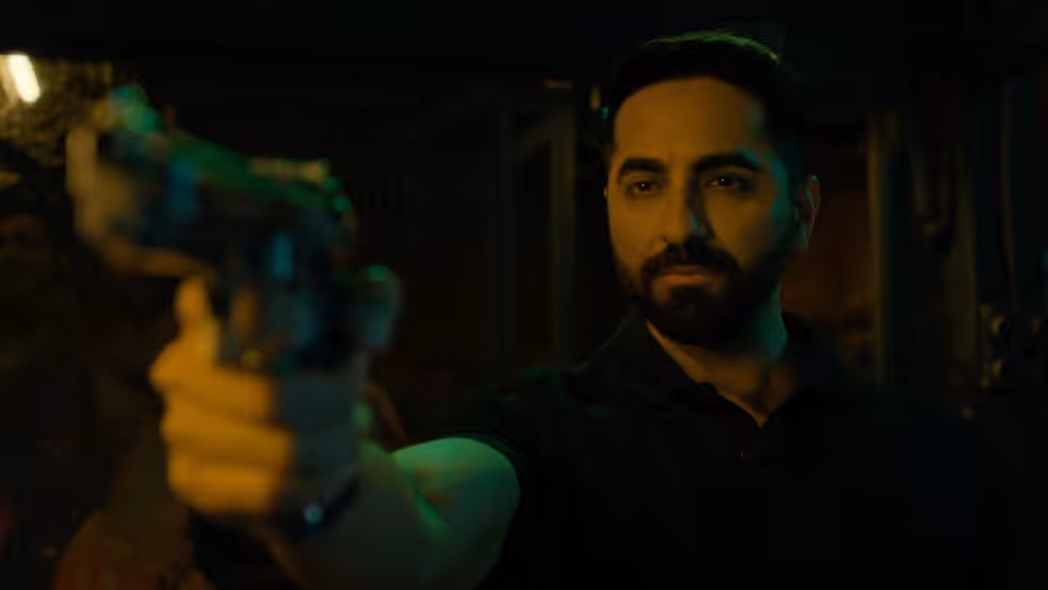 Bilal Ahmad (Ayushmann Khurrana) points a handgun in a dimly lit room