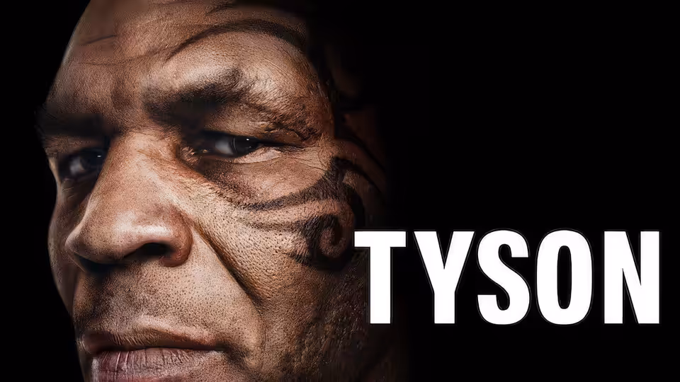 Mike Tyson faces forward in a close-up portrait against a black background