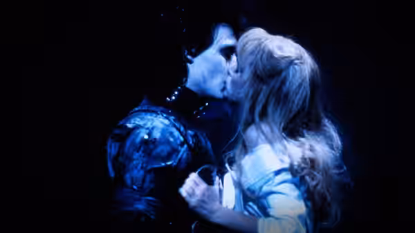Edward Scissorhands (Johnny Depp) kissing Kim (Winona Ryder) in darkness