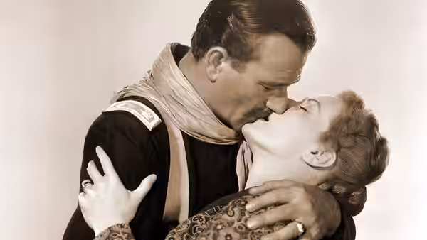 Kirby Yorke (John Wayne) kisses Kathleen Yorke (Maureen O’Hara)