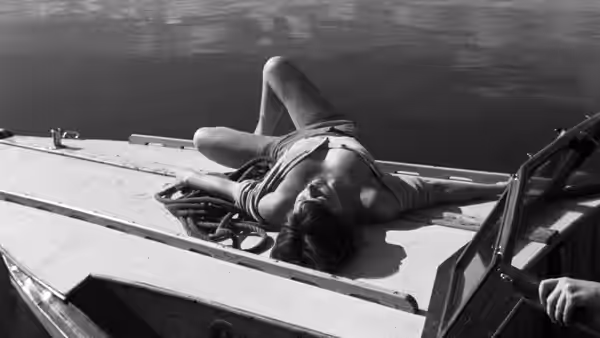 Monika (Harriet Andersson) reclines on the deck of a boat