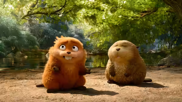 An orange animal stands alert next to a relaxed brown one by water