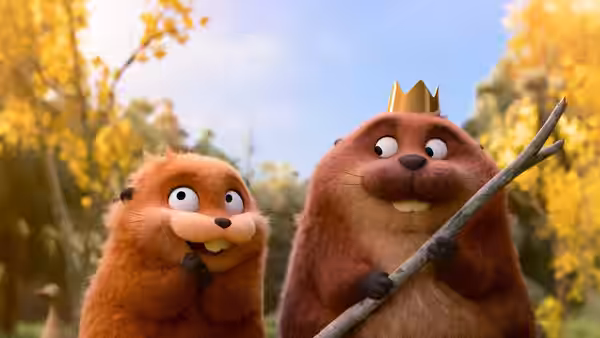 A crowned animal holds a stick beside another in a sunlit forest