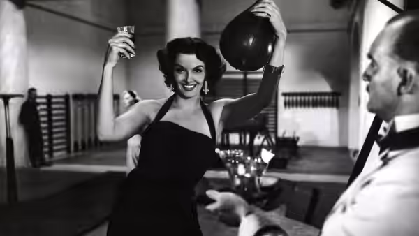 Dorothy Shaw (Jane Russell) raises a balloon and glass at a party