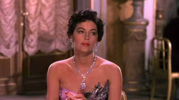 Maria Vargas (Ava Gardner) sits in an evening gown inside a grand room