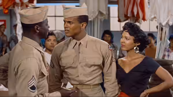 Joe (Harry Belafonte) faces a fellow serviceman as Carmen (Dorothy Dandridge) watches