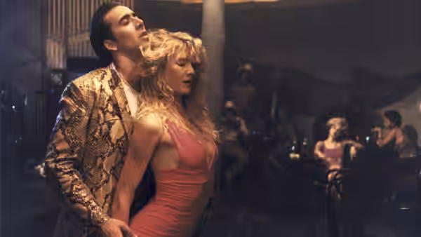 Sailor (Nicolas Cage) holding Lula (Laura Dern) close in a smoky nightclub