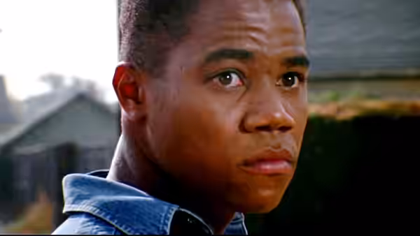 Tré Styles (Cuba Gooding Jr.) turns with concerned expression in residential setting