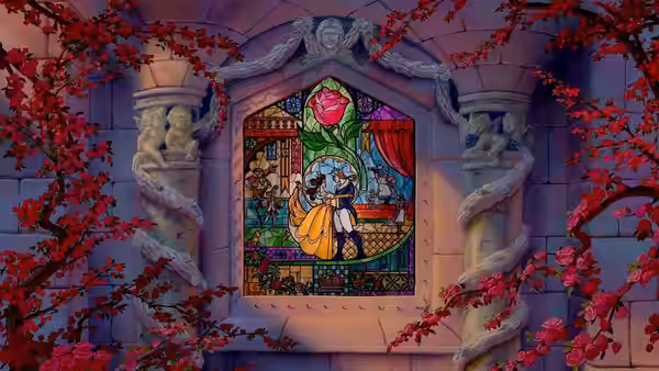 Stained glass window depicting Belle dancing with the Beast