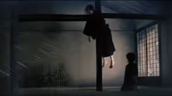 A person hangs from a beam as another figure watches beside a shoji window