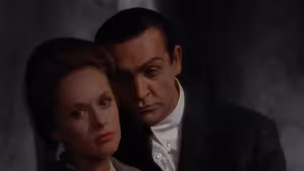 Mark Rutland (Sean Connery) leans close beside Marnie Edgar (Tippi Hedren)