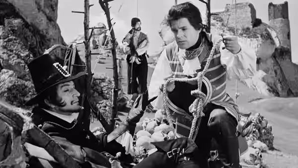 Alfonse Van Worden (Zbigniew Cybulski) confronts a seated woman among rocky ruins