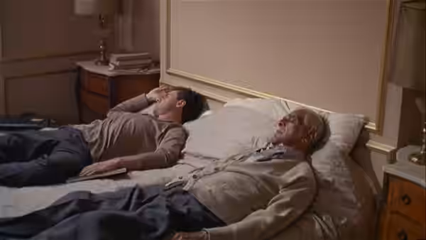 Bobby Thompson (Tim O'Kelly) and his father lie awake in separate beds
