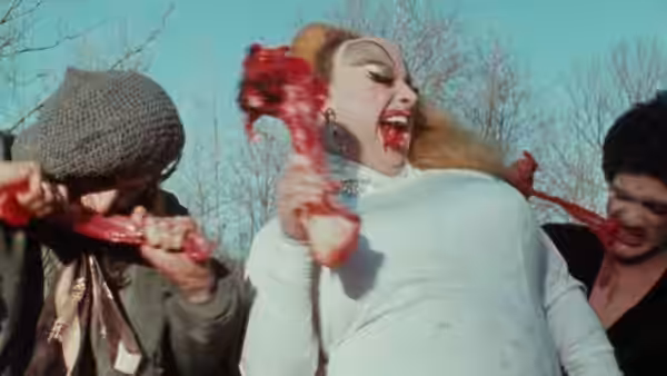 Divine (Divine) struggles between two men holding her arms outdoors