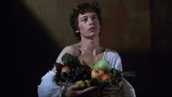 A young figure in a white robe cradles a basket of fruit