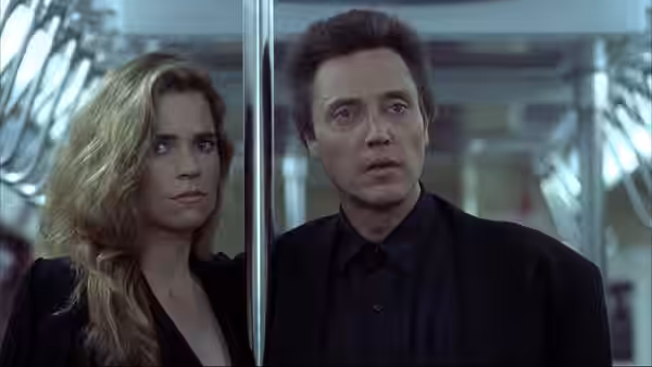 Frank White (Christopher Walken) and Jennifer (Janet Julian) ride an elevator