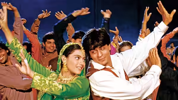 Raj Malhotra (Shah Rukh Khan) and Simran Singh (Kajol) dance amid a cheering crowd