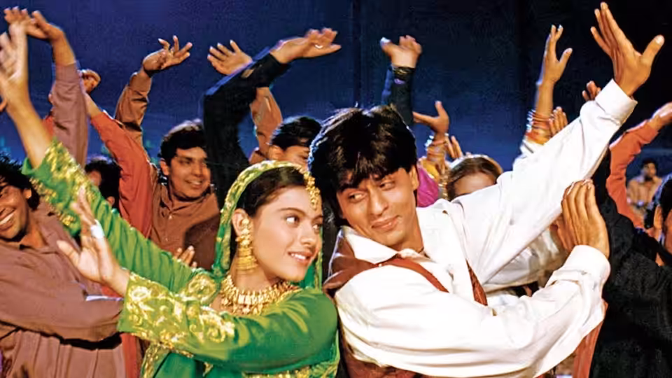 Raj Malhotra (Shah Rukh Khan) and Simran Singh (Kajol) dance amid a cheering crowd