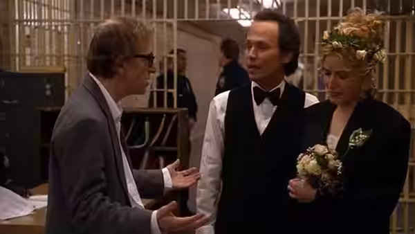Harry (Woody Allen) talks with a groom and bride holding flowers