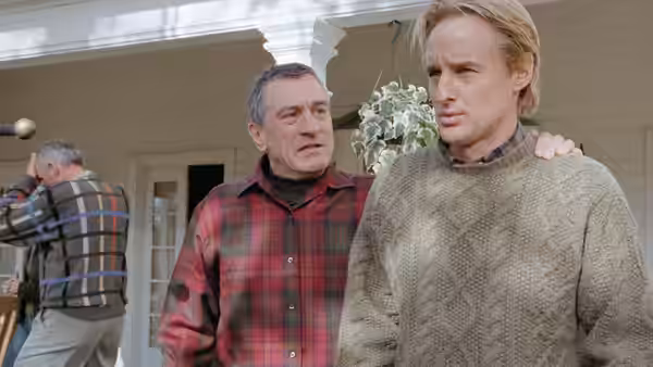 Jack rests a hand on Kevin’s shoulder on the porch