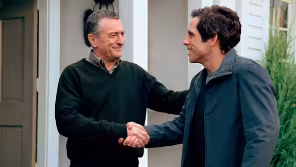 Jack and Greg shake hands outside the family home